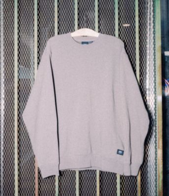 Vans Original Standards Loose Crew Sweatshirt hanging on a gate.