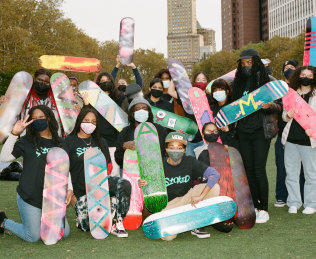 Group photograph with skateboards.