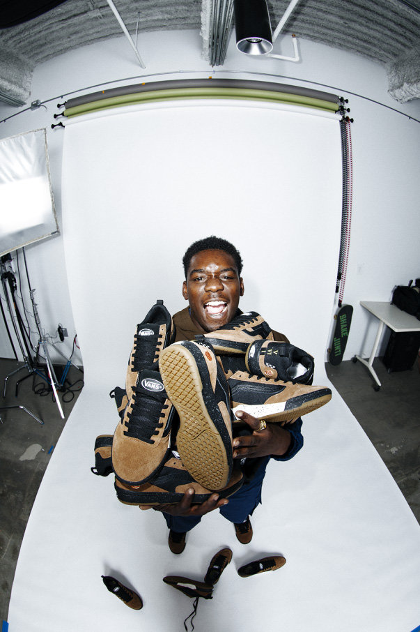 Zion Wright with arms full of Zhaba shoes with the Zion colorway.