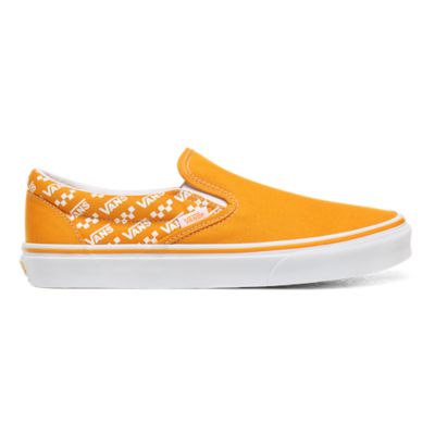 orange and white slip on vans