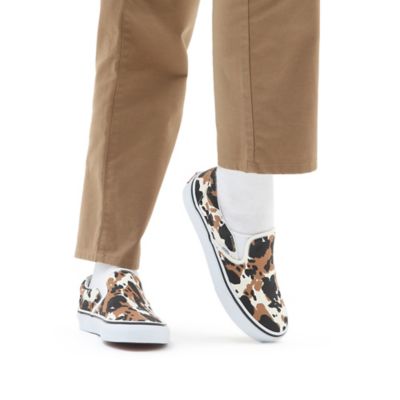 Vans cheetah best sale print slip ons